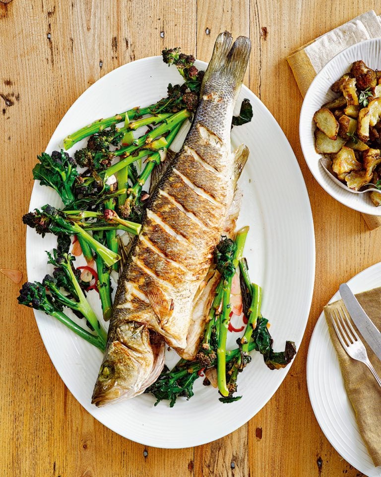 Whole sea bass with purple sprouting broccoli, chilli and garlic