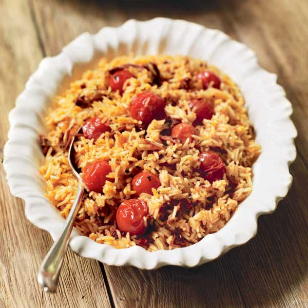 Triple-tomato pilaf with lamb kebabs