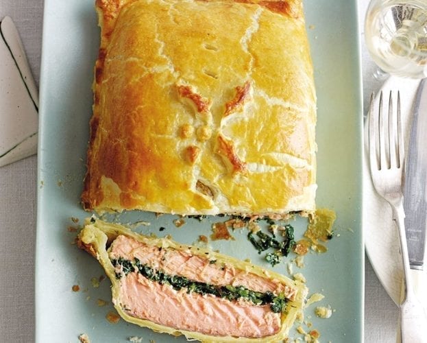Salmon en croûte, sliced on a plate