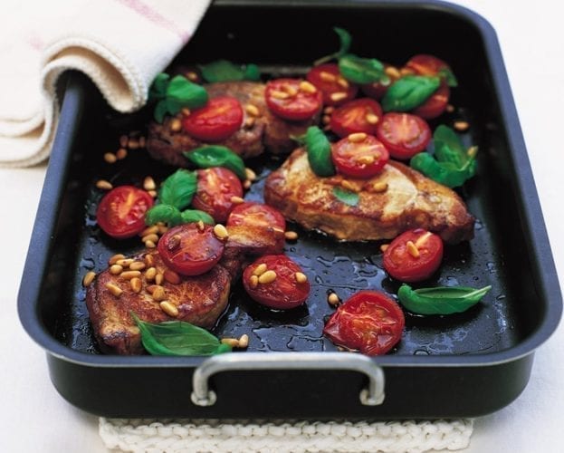 Pork steaks wrapped in Parma ham with butter bean salad