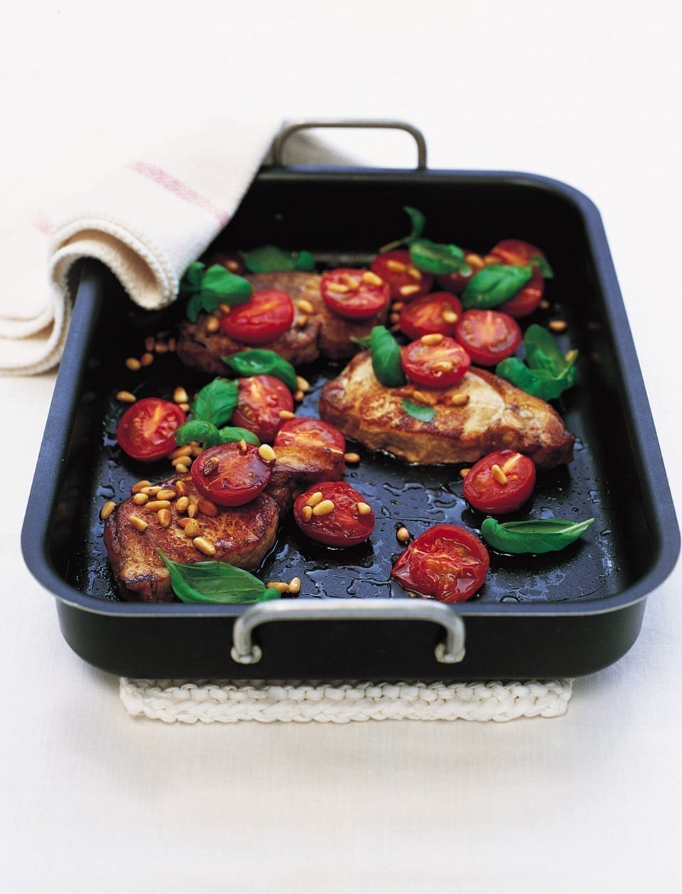Roast pork steaks with tomatoes and pine nuts recipe delicious. magazine