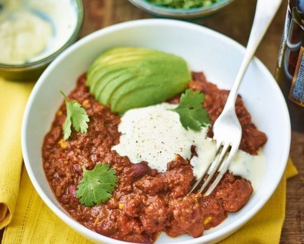 Real black bean chilli con carne with avocado and lime salsa