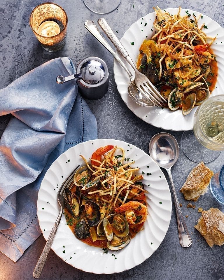 Mediterranean fish stew with straw potatoes