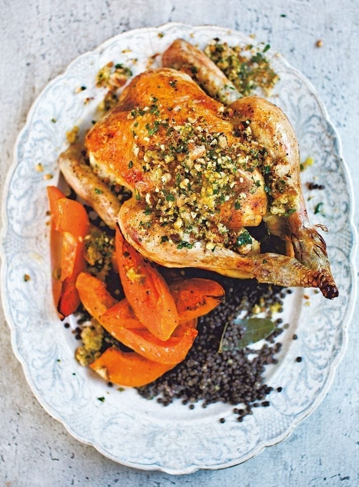 Roast chicken with squash, black lentils and hazelnut picada