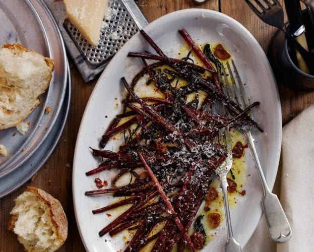 Charred cabbage with harissa butter and herb salad