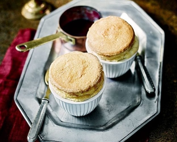 Vanilla and ginger soufflés with blackberry gin sauce