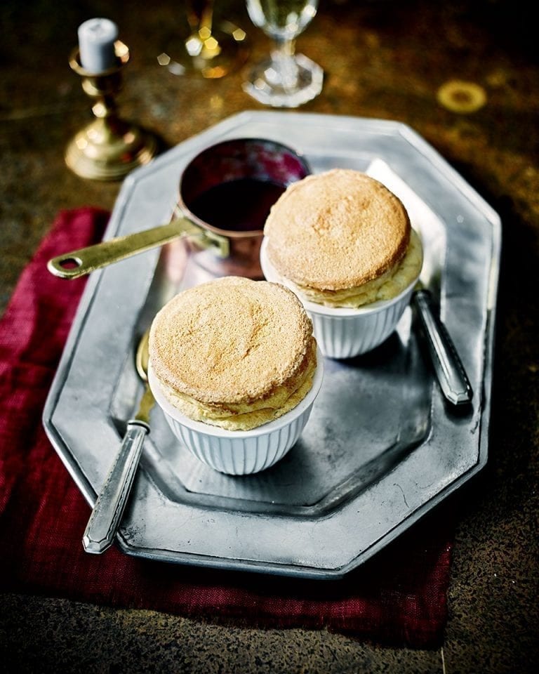 Vanilla and ginger soufflés with blackberry gin sauce