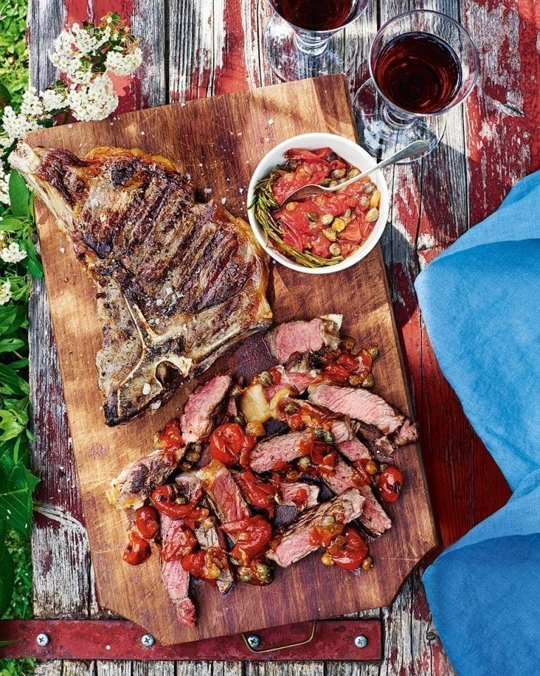 T-bone steaks with tomato, caper and rosemary sauce