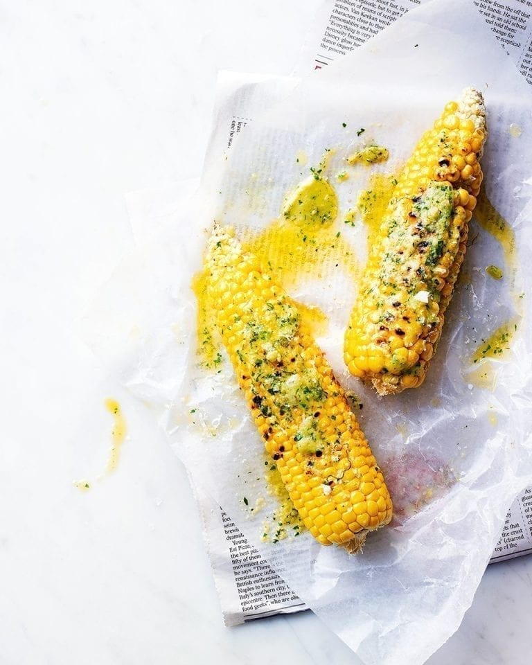 Corn on the cob with roasted garlic & herb butter delicious. magazine
