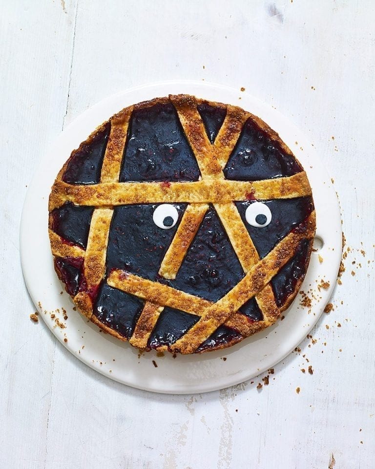 Spooky mummy blackberry jam tart