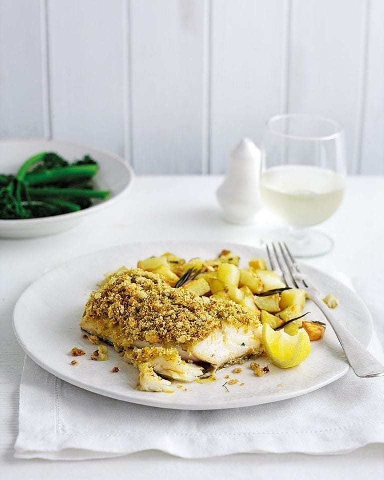 Pesto-crusted cod with garlic roast potatoes