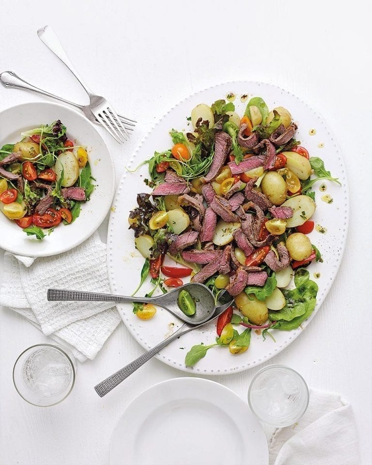 Beef tagliata with potato, rocket and parmesan salad