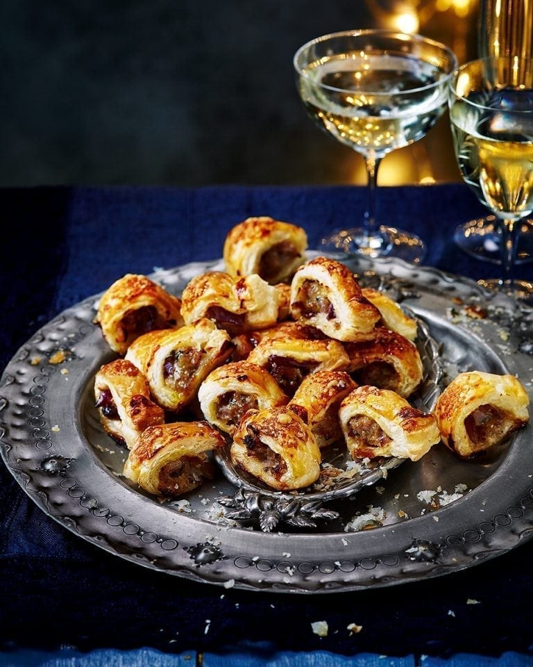 Mini sausage rolls with cheddar and red onion chutney