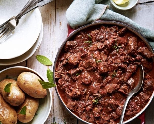 Theo Randall's beef stew shown in a serving bowl on a set table