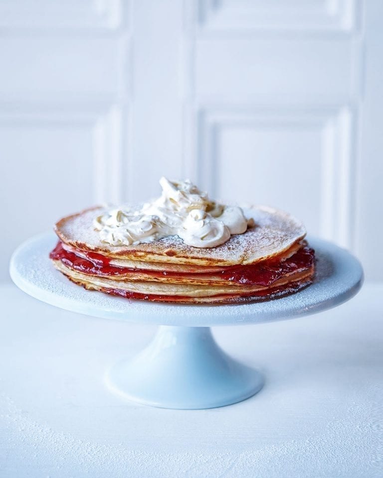 Giant pancake stack with jam and clotted cream