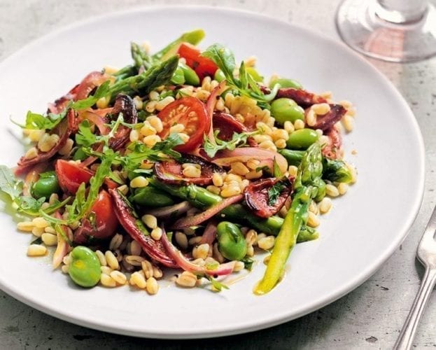 Wheat berry salad on a white plate