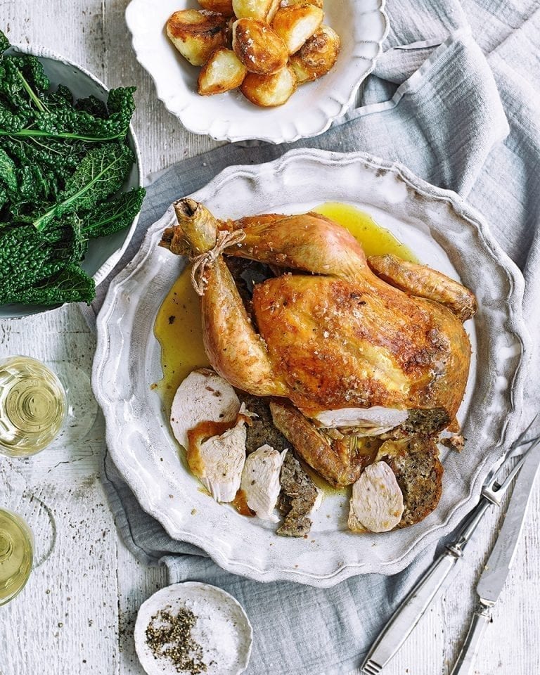 Roast chicken with lemon, oregano and olive breadcrumb stuffing