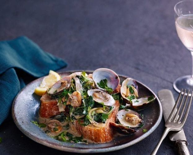 Lemon, parsley and spinach clams on toast