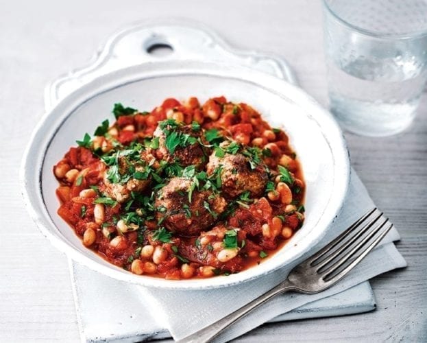 Turkey meatballs with beans in a white bowl