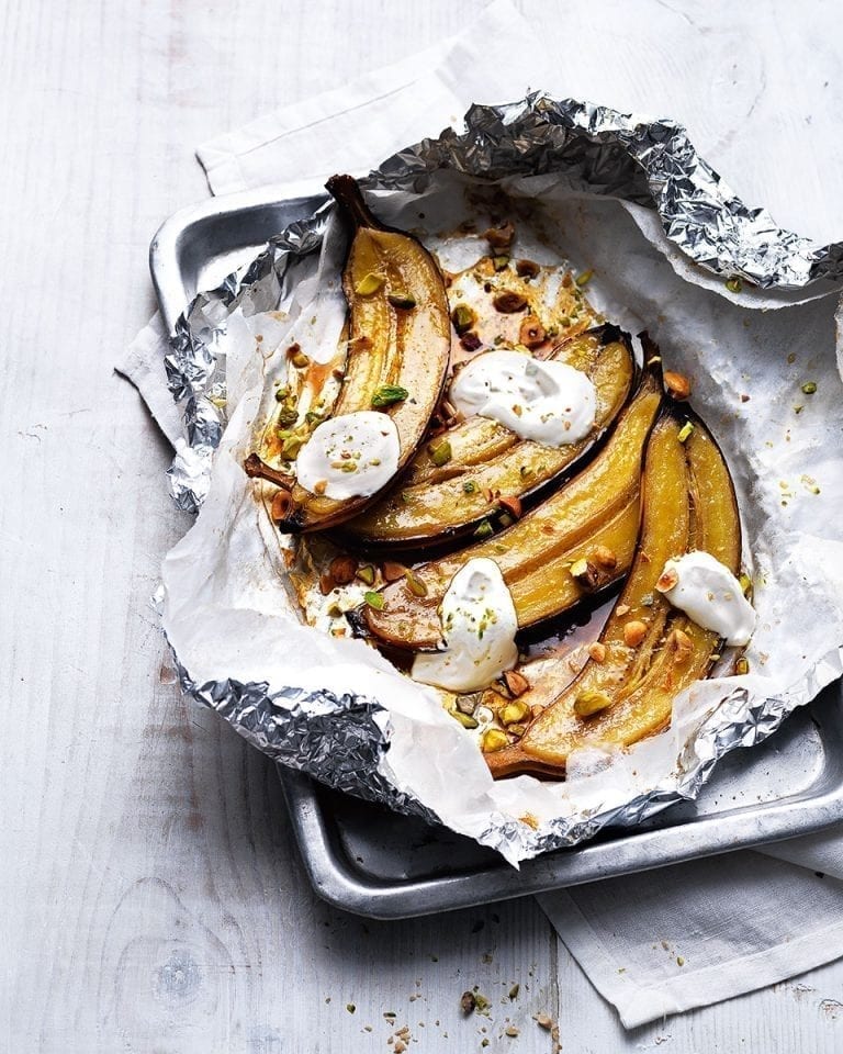 Maple and rum baked bananas with toasted hazelnuts and pistachios