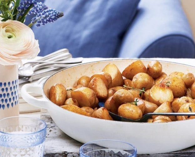 Pot-roasted new potatoes in a white dish