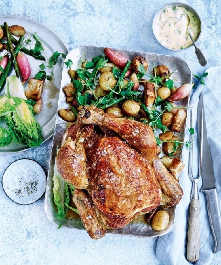 Roast chicken with crispy potatoes, summer salad and herby hollandaise