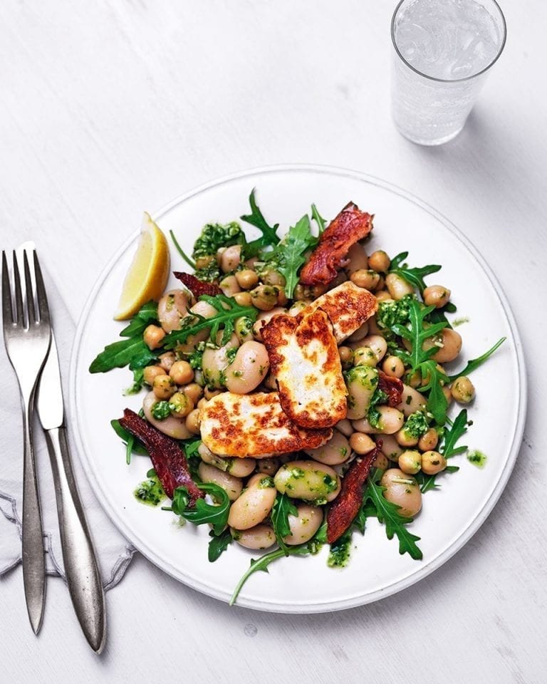 Warm pesto, chickpea and butter bean salad with halloumi