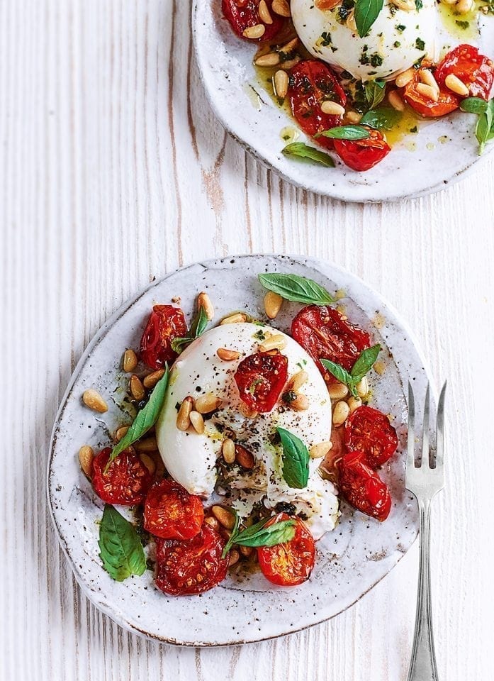 Burrata with sticky roasted tomatoes, pine nuts and basil