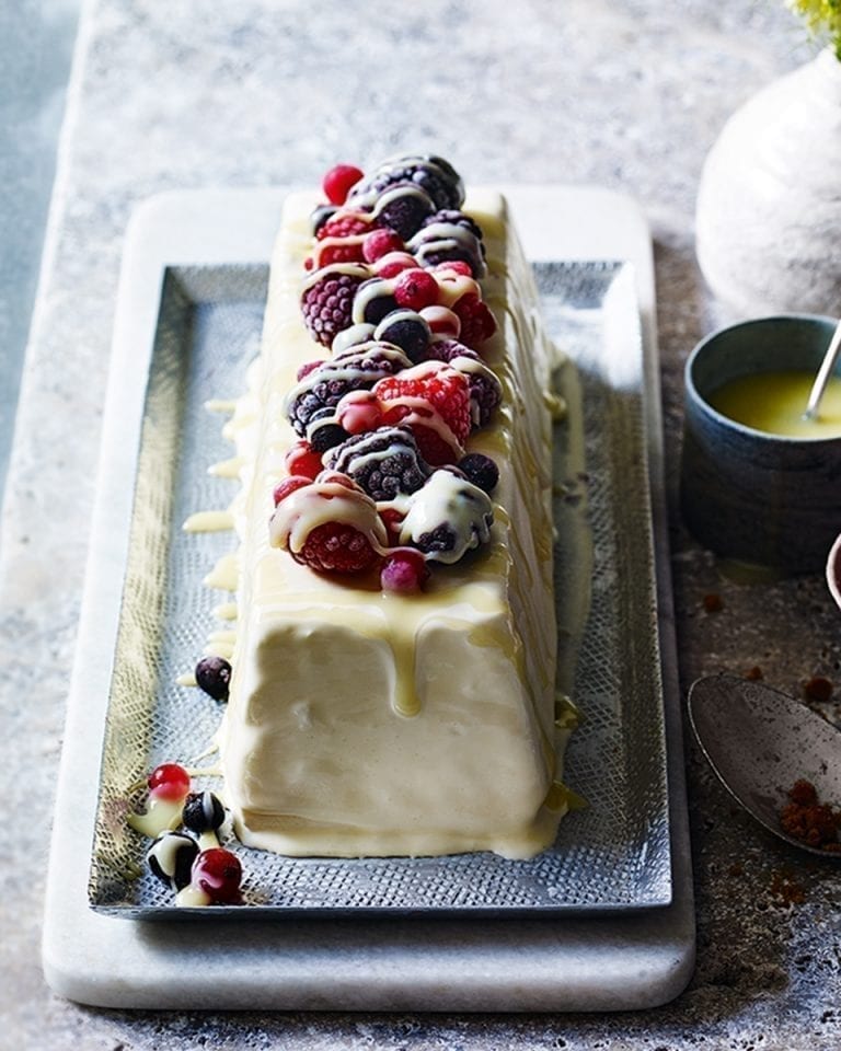 Semifreddo with iced berries and hot white chocolate sauce