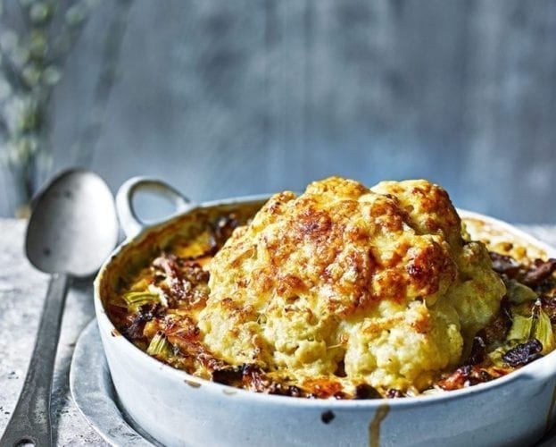 Whole baked cauliflower with pearl barley, wild mushrooms and cheese