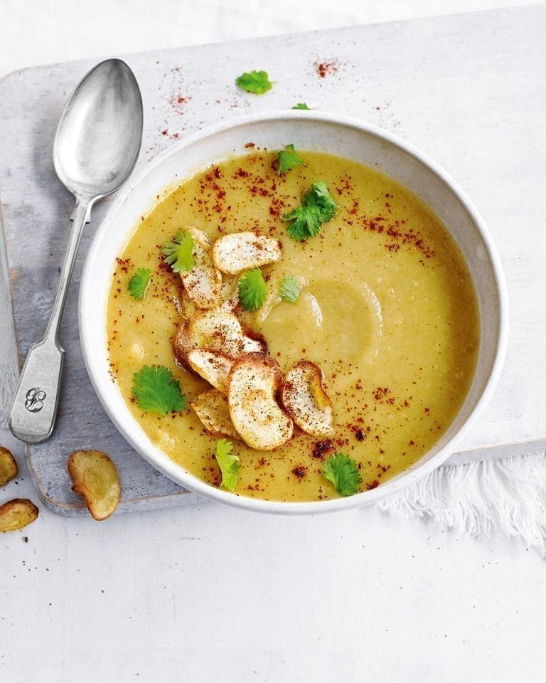 Curried parsnip soup in a white bowl