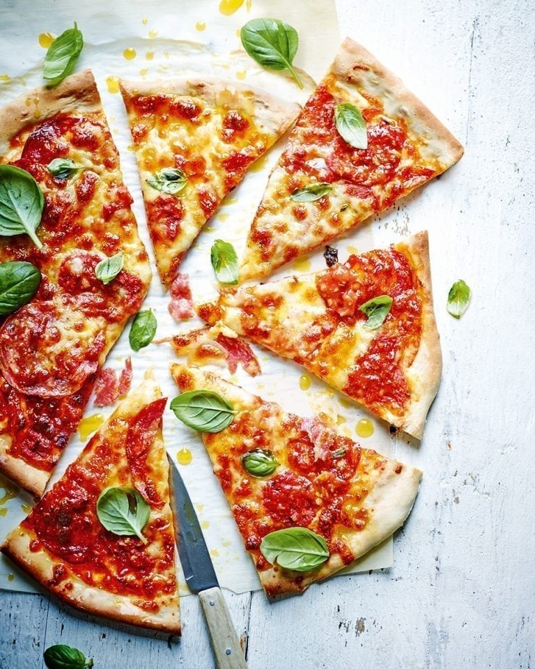 Sloppy Joe pizza shown cut into slices