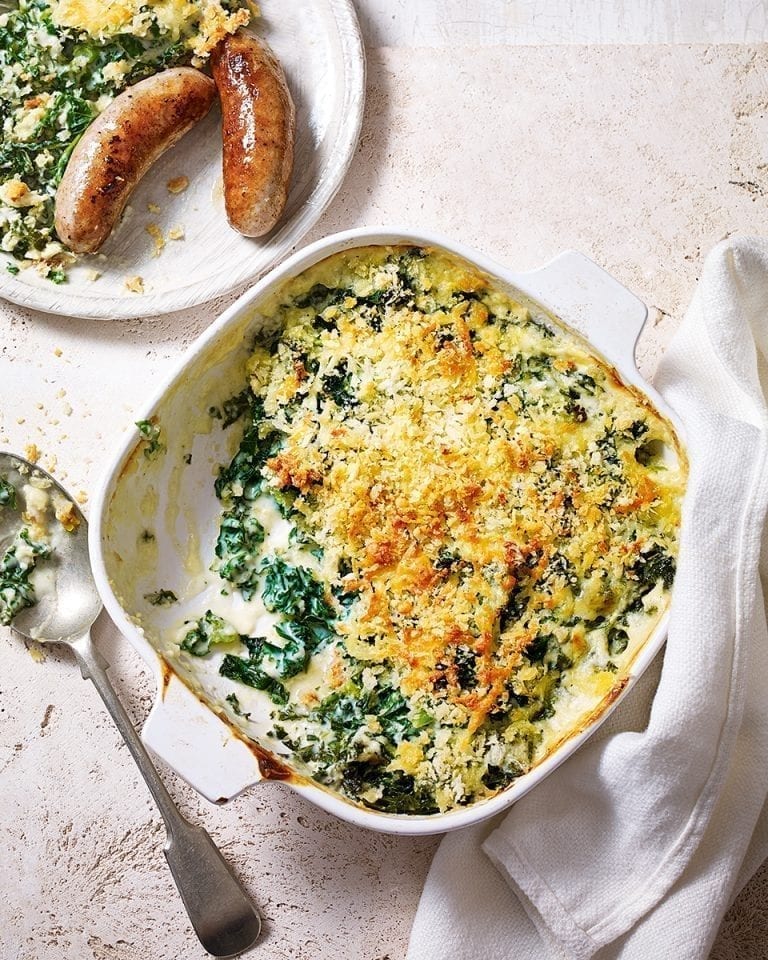 Sausages with creamy kale gratin