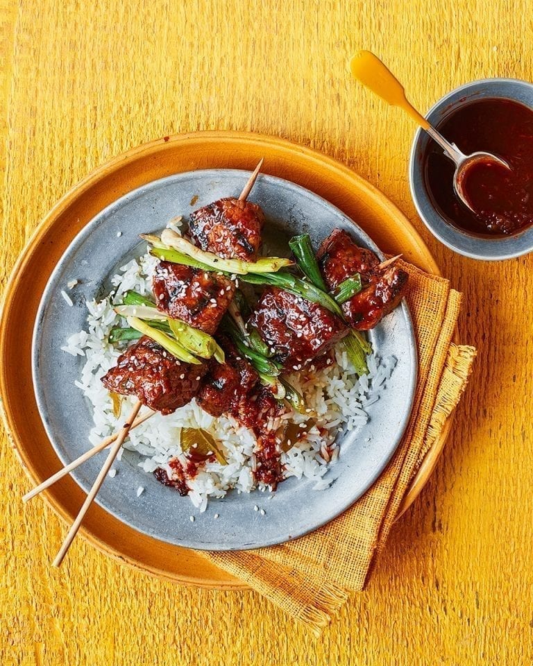 Beef and spring onion skewers with sticky rice