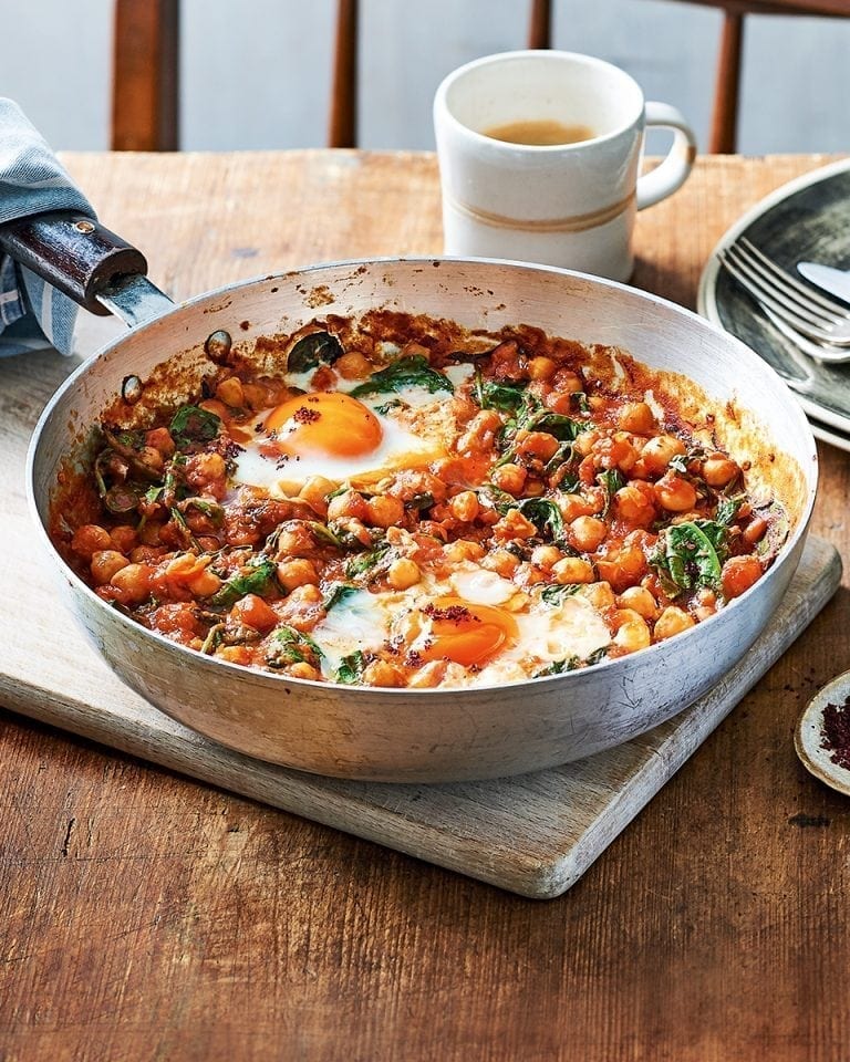 Spicy baked eggs with tomatoes and chickpeas recipe delicious. magazine