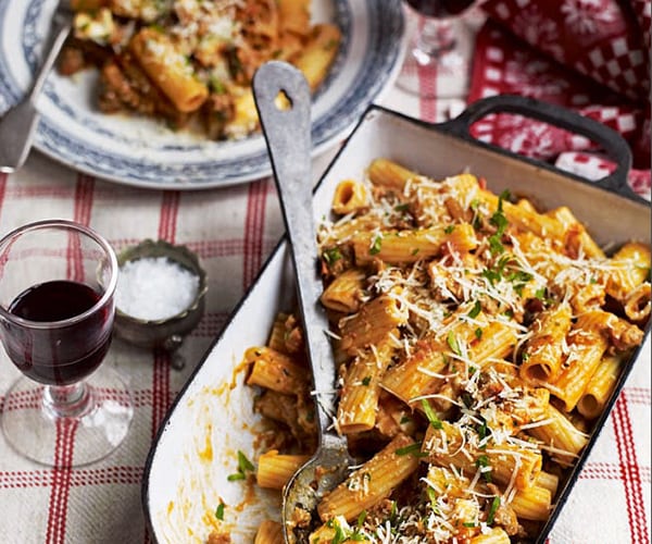 sausage ragu pasta topped with cheese image