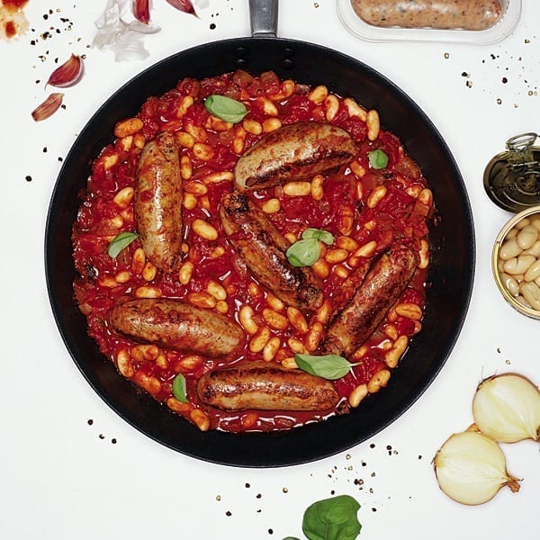 Sausages in tomato sauce with cannellini beans