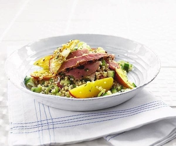 Ham with a peach and coucous salad
