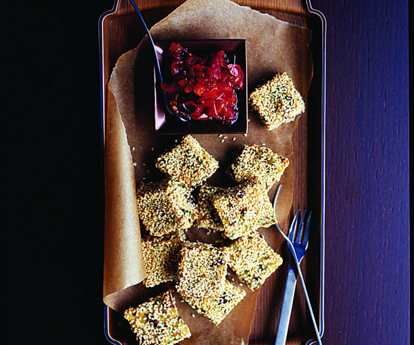 Polenta, olive and sesame cubes with caramelised peppers