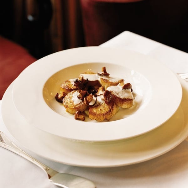 Scallops with confit potatoes and a ginger and thyme velouté