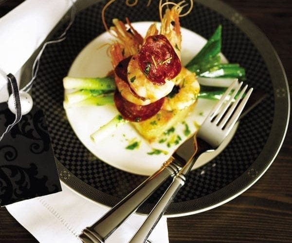 Chorizo with prawns on a black plate