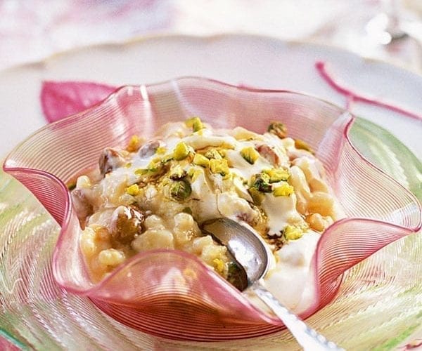 Rice pudding with honey soaked fruit and pistachios
