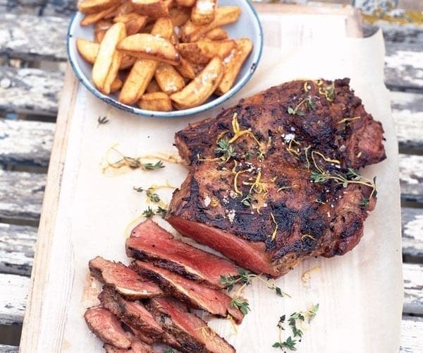 Spiced leg of lamb with lemon-roast potatoes