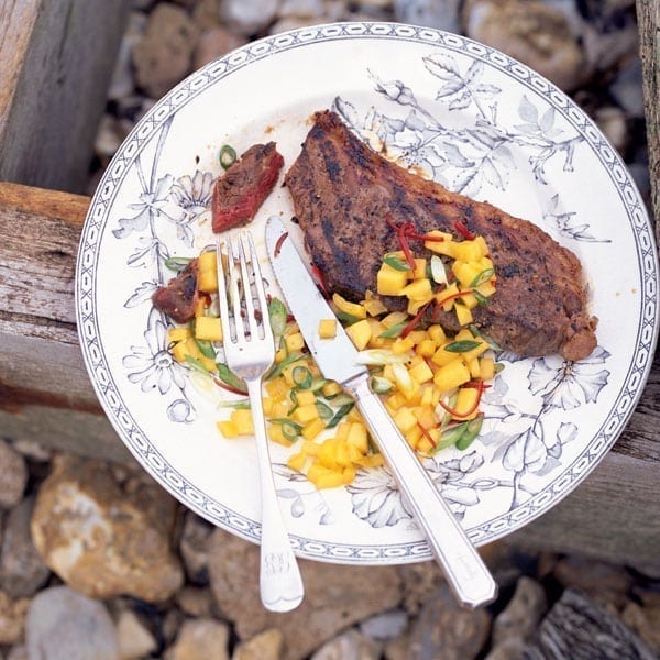 Honey and soy-glazed steaks with mango and chilli salsa