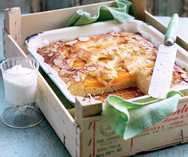 Apricot buttermilk cake with fresh apricots, shown in a wooden box
