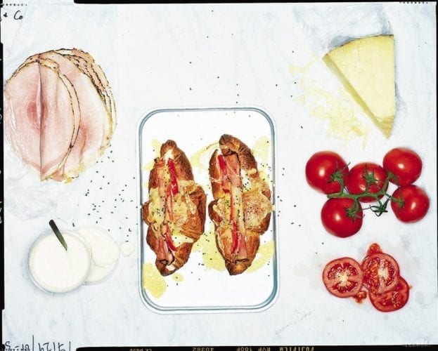 Croissants stuffed with bacon and creamy scrambled egg
