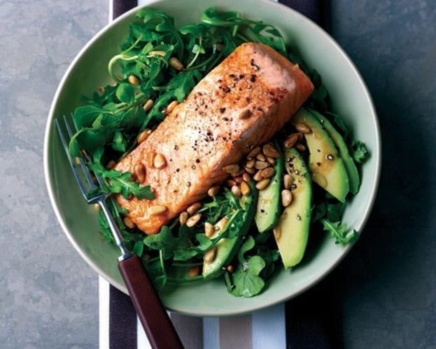 Grilled salmon with rocket, avocado and pine nut salad