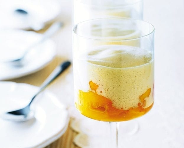 Zabaglione with peaches in a tall-stemmed glass