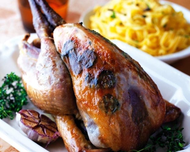 Pot-roast guinea fowl with pistachio stuffing