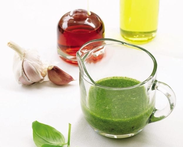 Basil vinaigrette in a glass jug